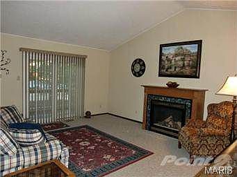 Great Room with vaulted ceiling, gas fireplace and slider to dec