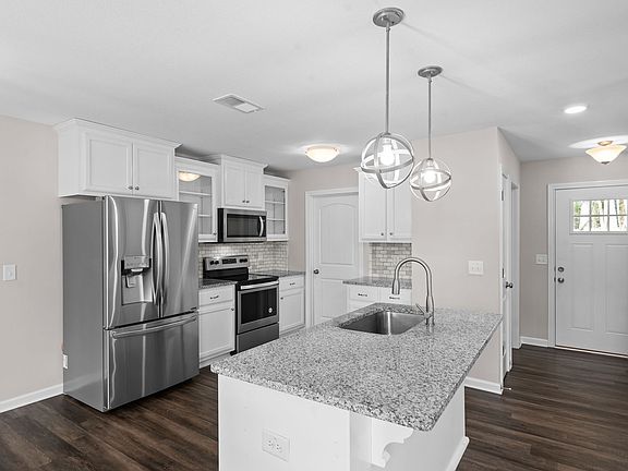 Front Door, Entry-Way, Coat Closet, 1/2 Bath, Glass Cabinets, Large Island With Deep Sink