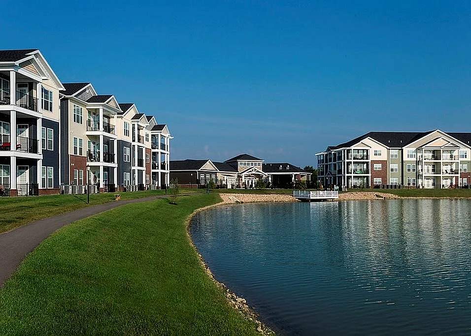 Amenities include a 6-acre lake, fishing deck, and walking trail.
