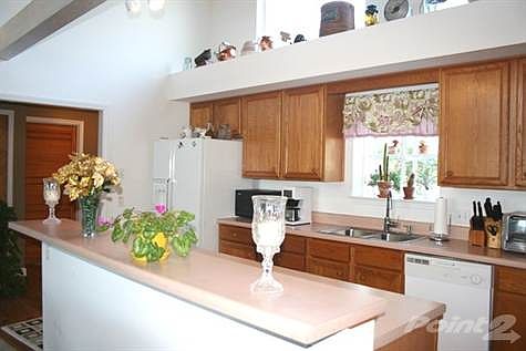 Inviting kitchen with plenty of cabinets.