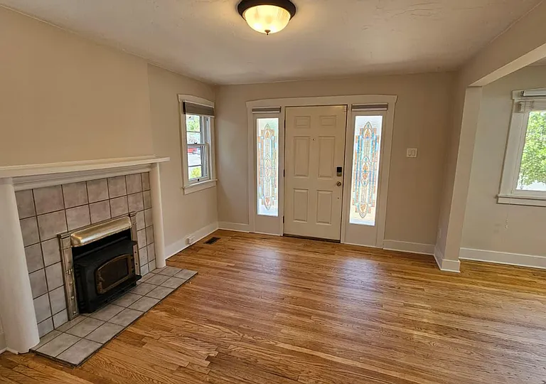Living Room with Restored Floors + Front Entrance