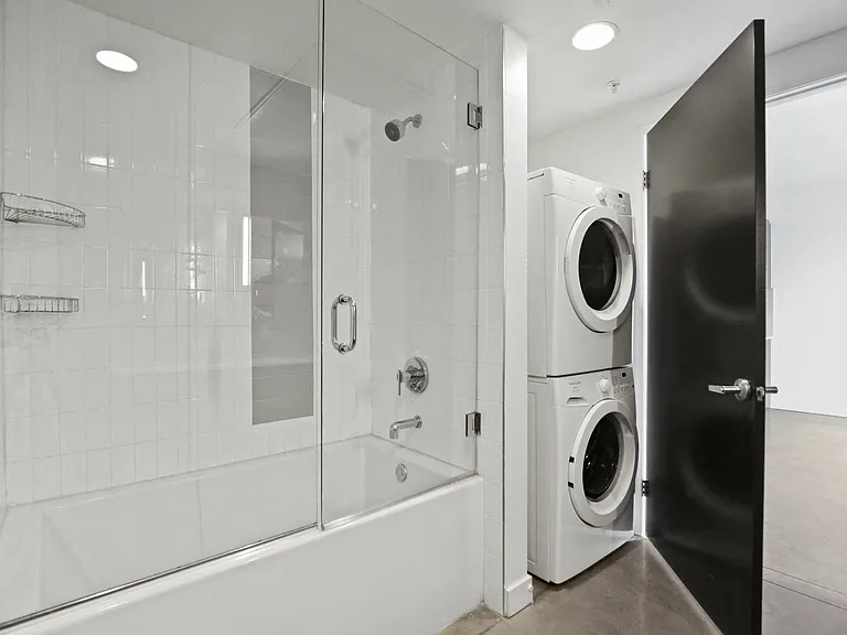 Bathroom with In-Suite Washer & Dryer and Full-Size Shower Bath
