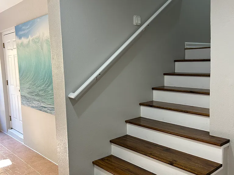 Stairs to 2nd floor and living space.