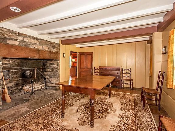 The "Keeping Room" with beautiful stone
        fireplace