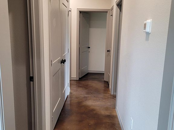 Hallway to bedrooms and laundry hookups