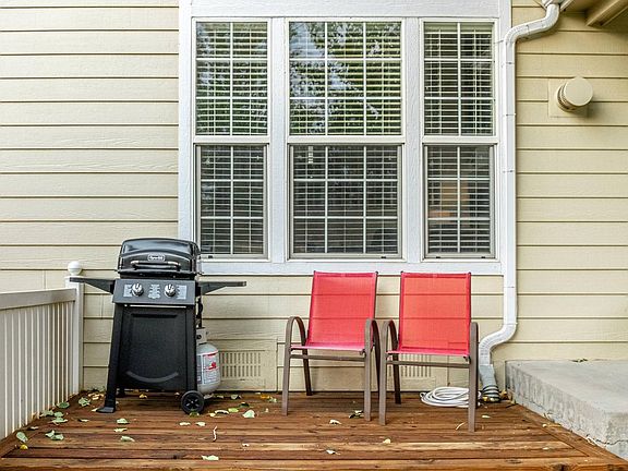 Front wood deck looking out onto a large park-like area ideal for kids to play.