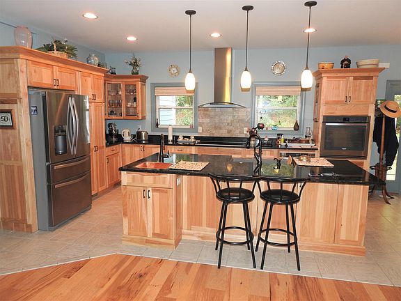 Large Island and Breakfast Bar with Granite Counter Tops