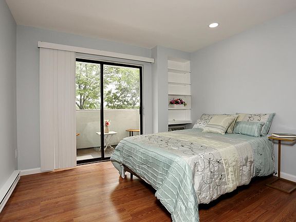 Bedroom part of the studio - sliding doors to the balcony with Manhattan views