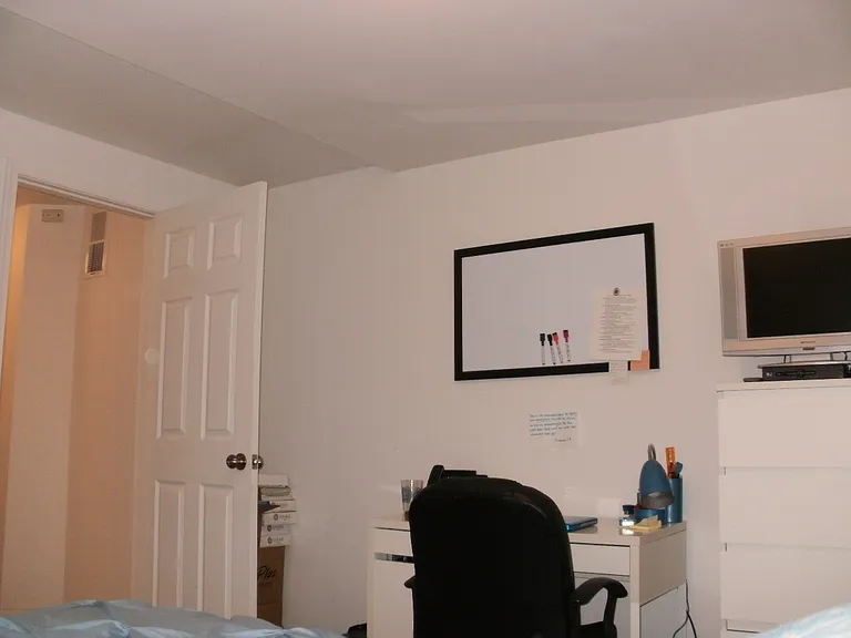Picture of 2nd bedroom showing desk area, looking back at the doorway.