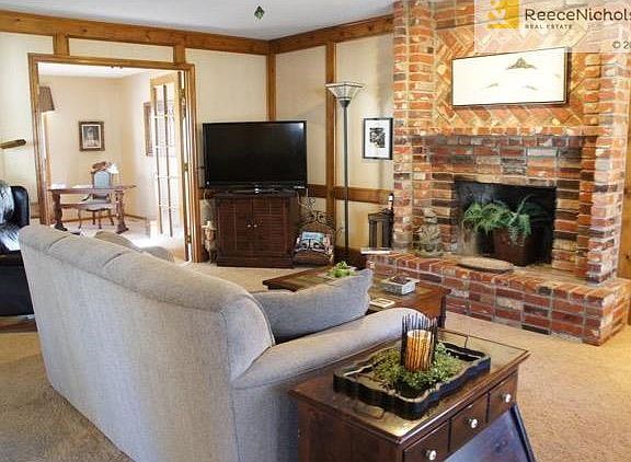 Large brick fireplace in Family Room.French doors leading into Den.