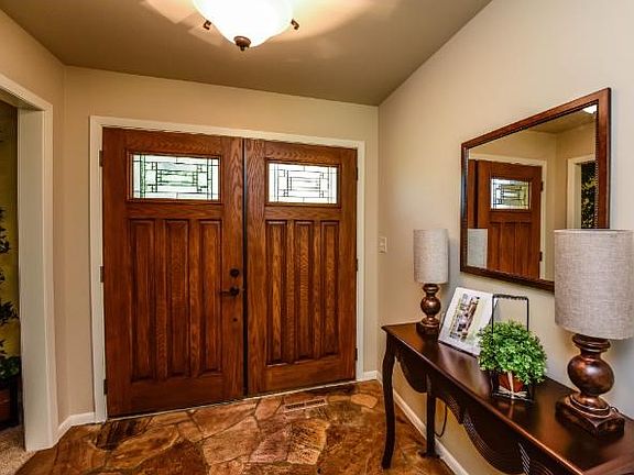 Very large entry way with beautiful wood double doors.
