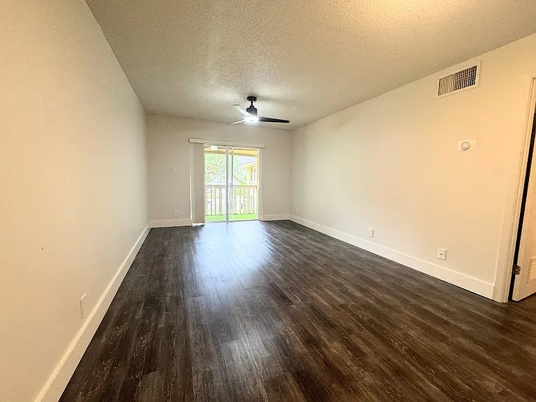 Spacious Living Area with a patio looking out on the yard.