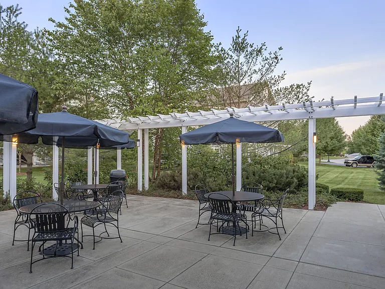 Outdoor Courtyard with Pergola and Bistro Tables