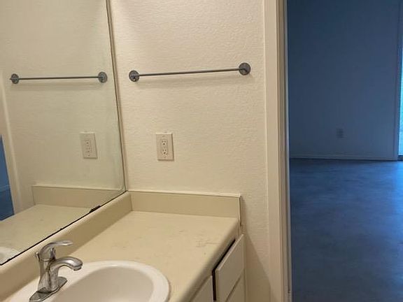 Jack and Jill style bathroom, sink rooms on each side of toilet and shower - great for roommates.