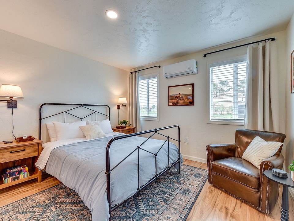 Fully furnished. Queen bed and leather swivel chair. Abundant natural light. Mini split for heating and cooling. Wood-look laminate flooring.