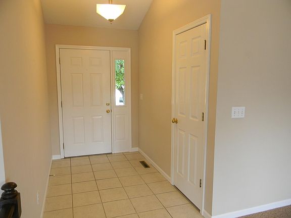 Spacious Foyer includes Guest/Coat Closet (updated hardware not pictured)