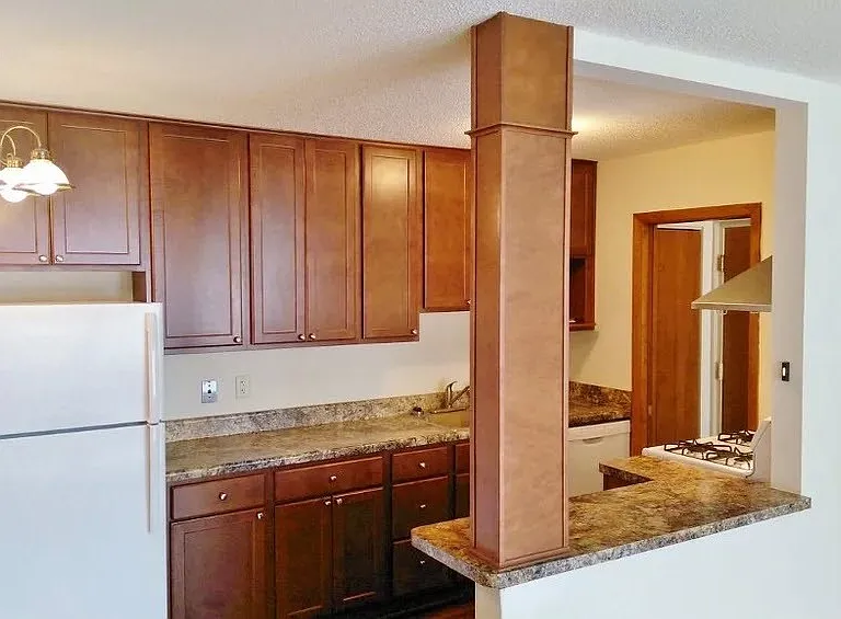 Step into the modern charm of Central Lakes of Uptown. This inviting kitchen features stylish wood cabinetry and sleek granite countertops, perfect for culinary creativity. Elevate your living experience todayschedule a tour now!