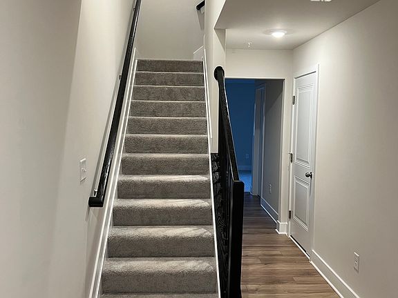 From the main entrance. Alley leading to the office/additional bedroom, full bath and backyard. Stairs to Level 1.