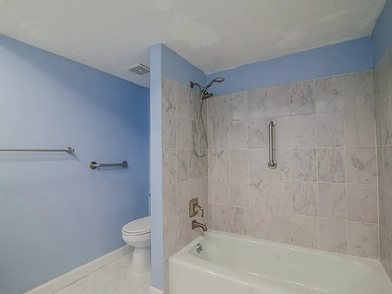 Guest bathroom with grab bars