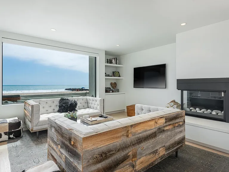 Living Room with fireplace and ocean view