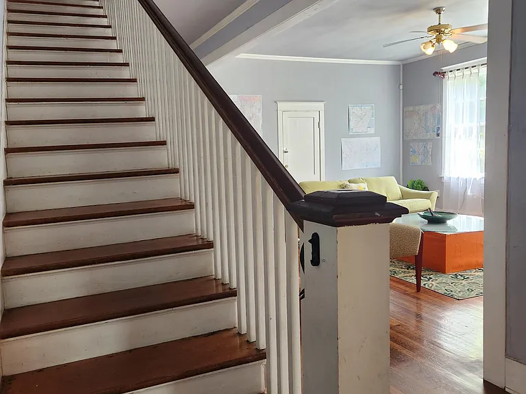 Steps to upstairs for bedrooms 6 and 7 and their private bath