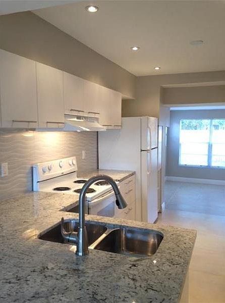 1st image of 210 NE 51st St