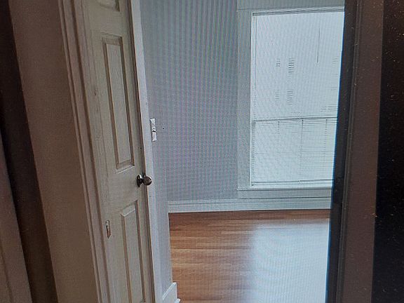 master bedroom with walk-in closet