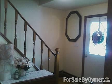 Foyer - neutral color
						:
						Opens to wood floors and neutral colors.
