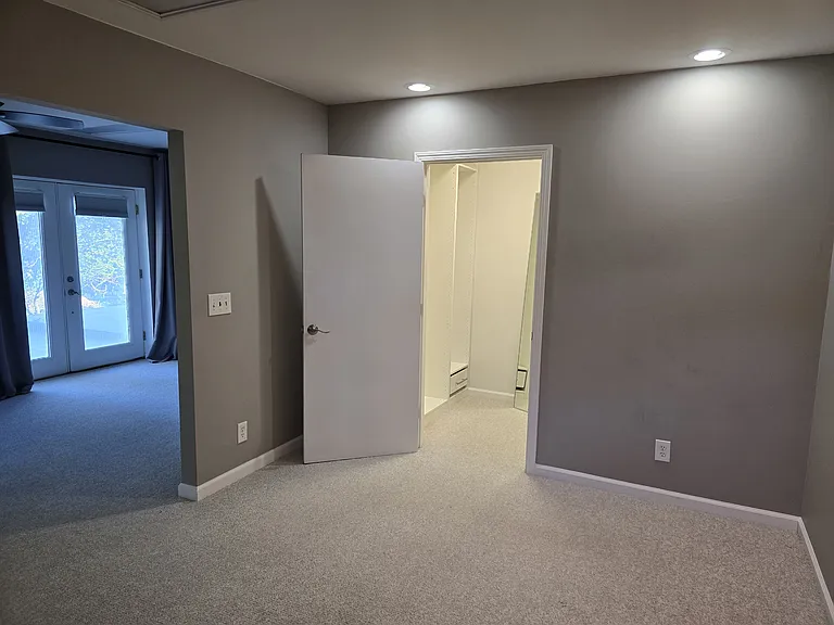 Looking back through from bedroom to French doors.