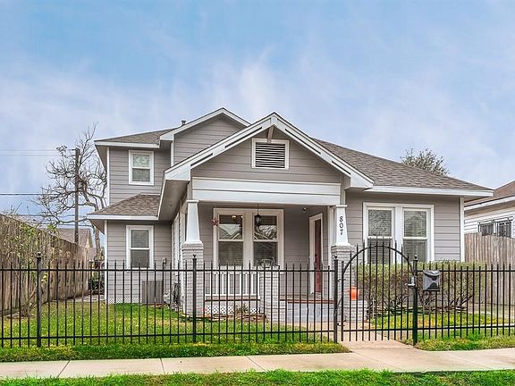 Expansions include a new second-story extra master bed & bath, as well as a downstairs laundry room, tucked beneath an elegant hardwood staircase with decorative wrought-iron railing.