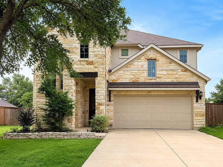 Front exterior with long driveway, ample parking and extra side-yard privacy
