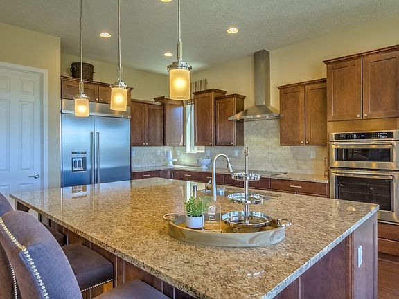 The executive kitchen island can be used for quick meals with the family or preparing delicious home cooked meals.