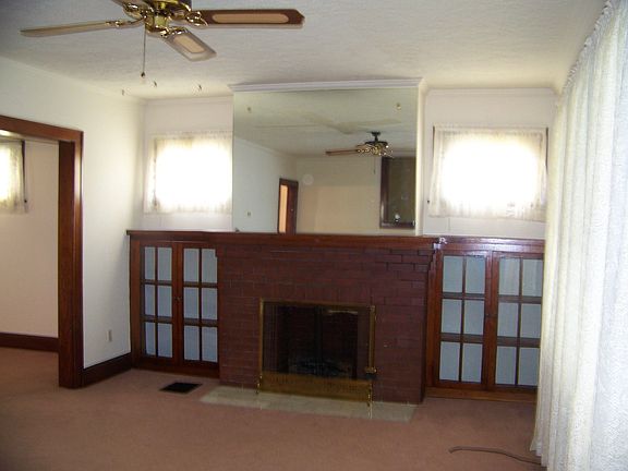 Beautiful wood bookcase flank dec. fireplace
