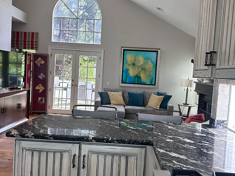 Kitchen and open family room with deck