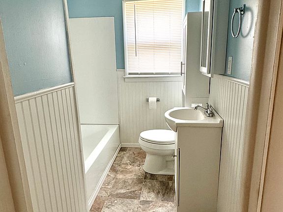 Bathroom with new flooring and tub/shower combo