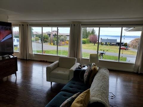 Living room looking towards the front of the house. Showing the water view.