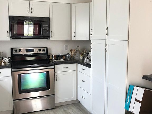 Large kitchen area with lots of storage