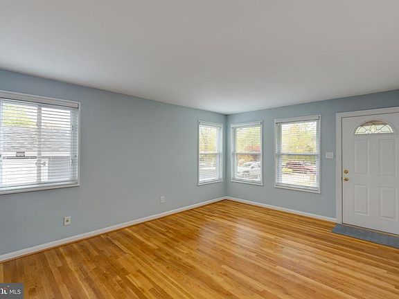 Light-filled living room with 4 windows
