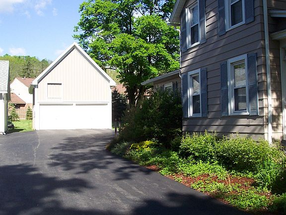 Driveway & 2 story garage.