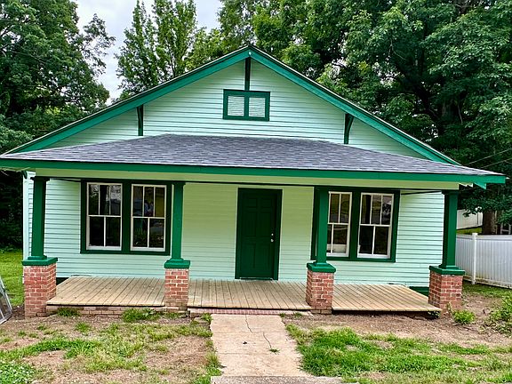 The front porch will soon be ...either painted the dark green or wood stained and top-coated with clear. Help make the decision.
