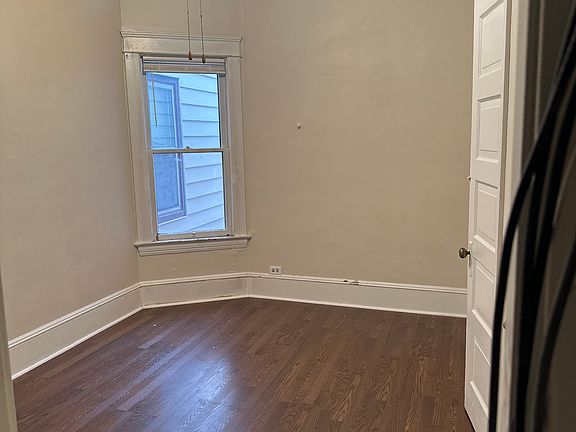 Bedroom 1, large closet, ceiling fan, original wood doors