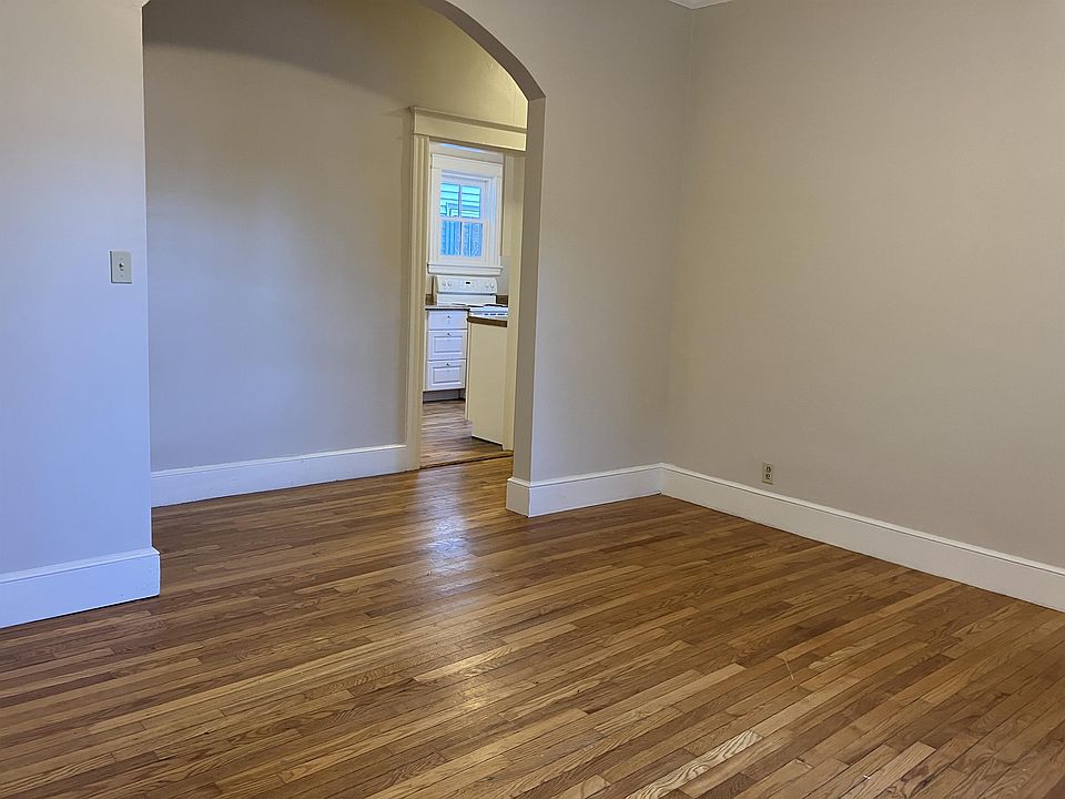 Living room with view of hall, kitchen