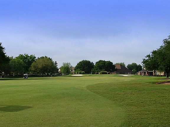 Step out your back door and you're a mere seven iron from the Green.  The cart path is also on the opposite side of the fairway, so that means greater privacy.