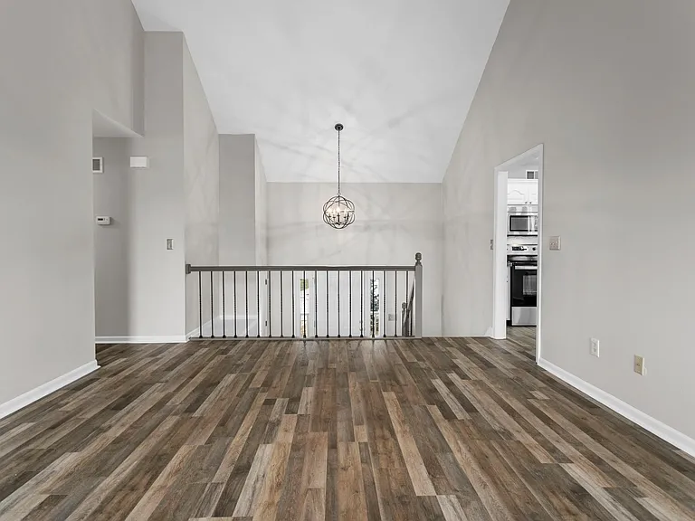 Standing at fireplace and looking towards front door