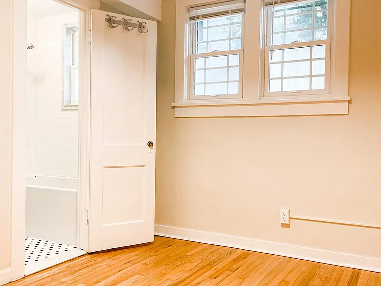 Bedroom south facing with door to modern bathroom