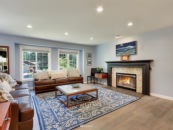 Tastefully updated with warm accents throughout. Featuring refinished hardwoods on upper level & wood-burning fireplace.
