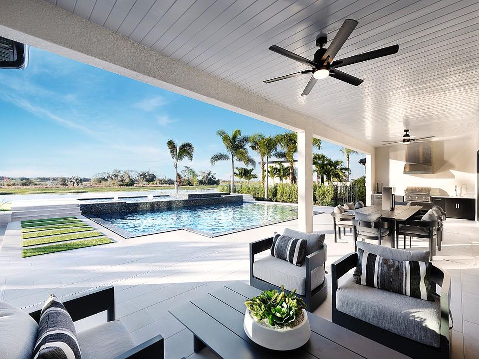 Spacious covered lanai space with resort-style pool and spa