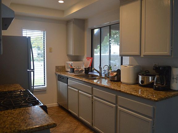 Light and airy kitchen with granite counters and all applian