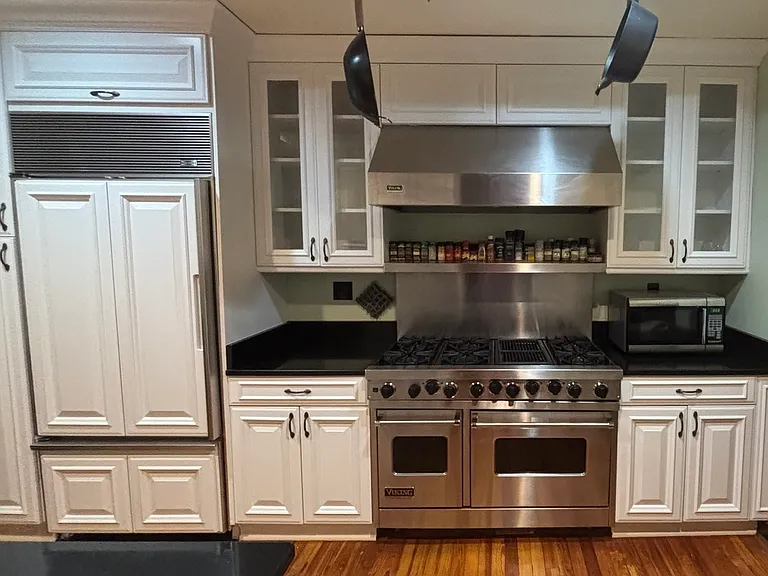 Built in Refrigerator and six burner Viking Stove and Cabinets