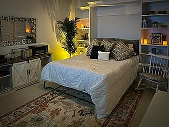 This is by far the coziest night time setting. The Murphy bed in the pull down position.